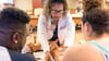 Nurse educator instructs a couple during a prenatal class